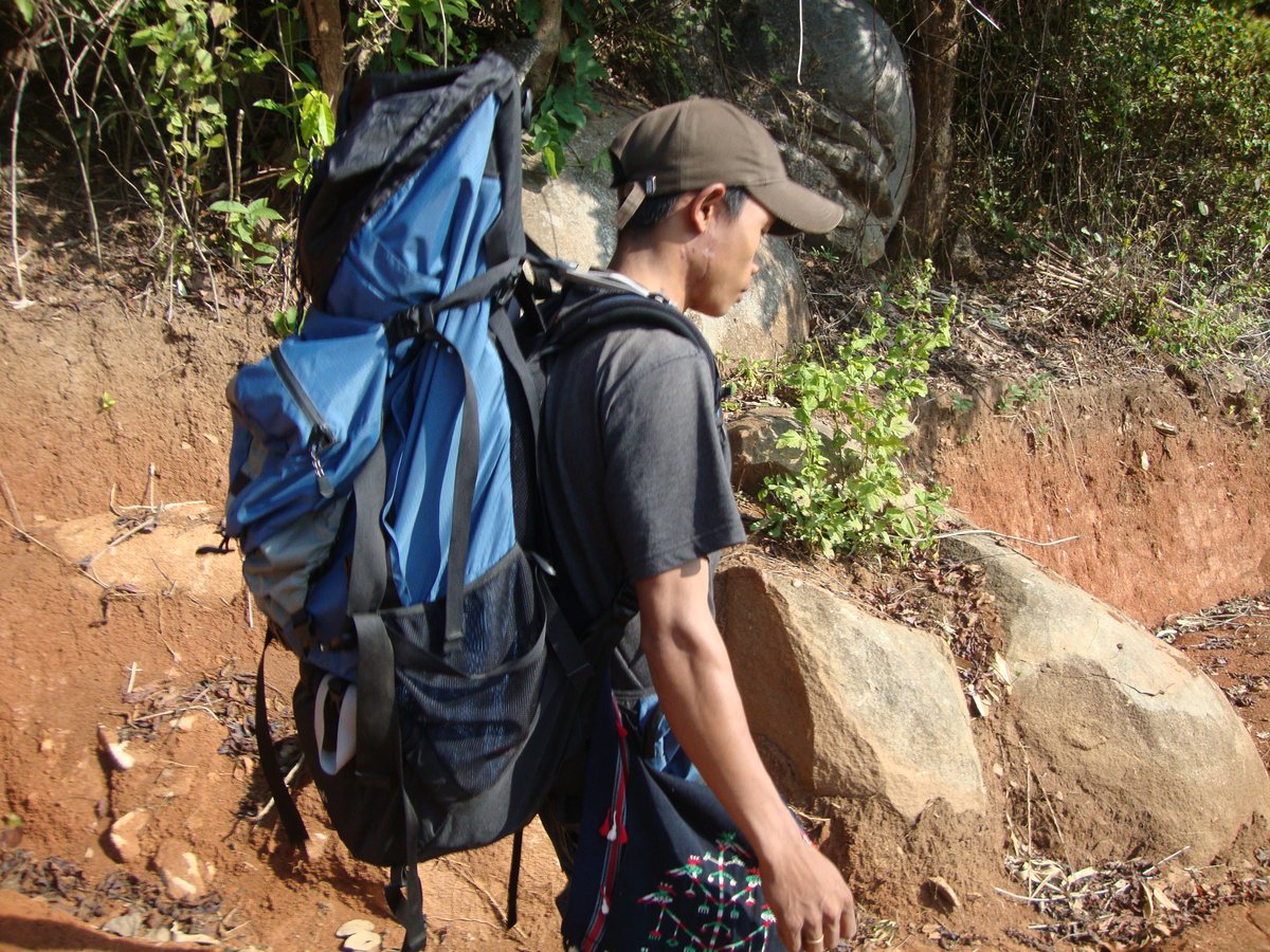 KABC outreach worker walking to a remote village