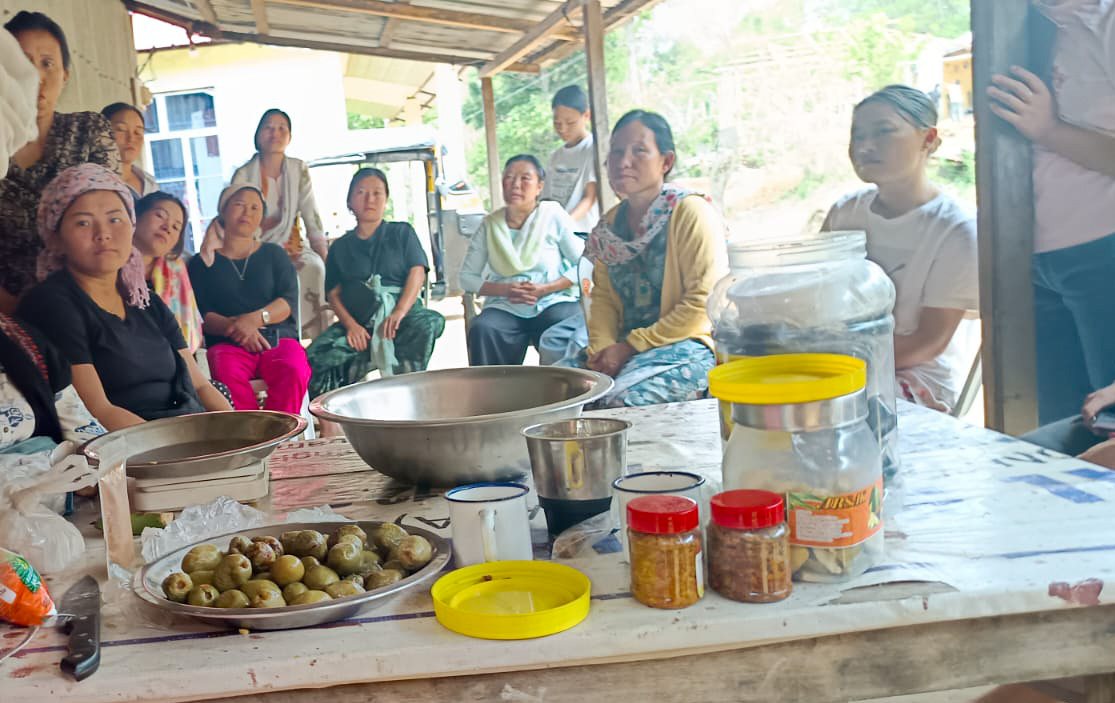 Women participating in a food processing training session